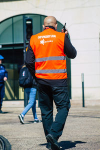 Rear view of men working