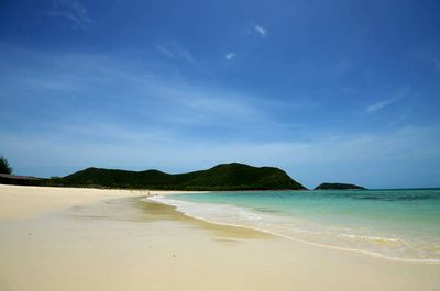 View of beach against blue sky