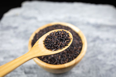 High angle view of black coffee on wood
