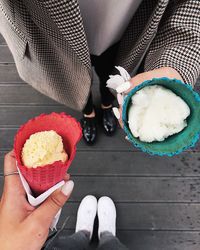 Low section of person holding ice cream cone