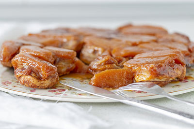 A dish with an apple tarte tatin.