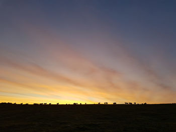 Scenic view of silhouette landscape against sky during sunset