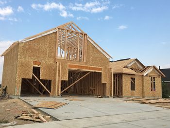 Old building against sky on sunny day
