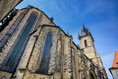 Low angle view of building against blue sky