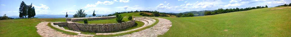 Panoramic view of green landscape against sky