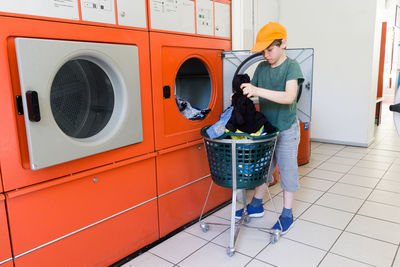 Full length of woman standing in basket