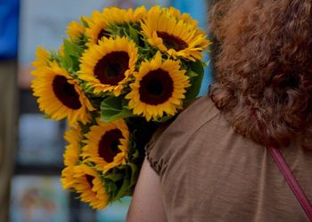 Close-up of woman holding flower
