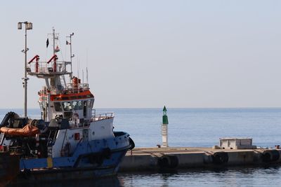 Ship in sea against clear sky