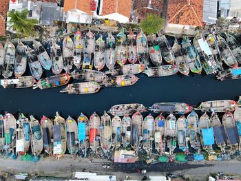 Beautiful aerial view of boats lined up in a fishing village, in cirebon, west java - indonesia.