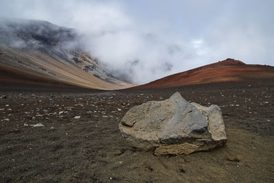 Scenic view of arid landscape against sky