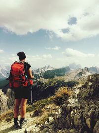 Rear view of man standing on hill