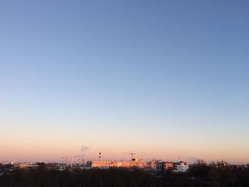 Cityscape against clear sky