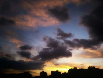 Low angle view of cloudy sky at sunset