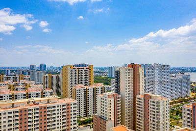 Buildings in city against sky