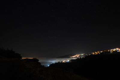 Scenic view of sea against sky at night