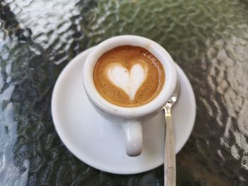 High angle view of cappuccino on table