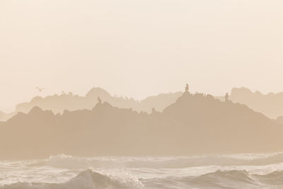 Scenic view of mountains against sky during sunset