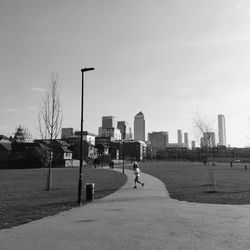 Street amidst buildings in city against sky