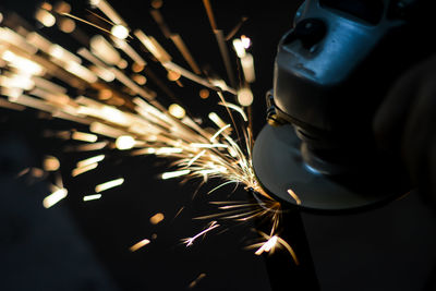 Close-up of welder working in factory