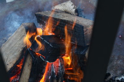 High angle view of bonfire on barbecue grill