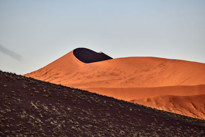 Scenic view of desert against clear sky