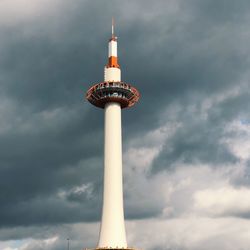 Low angle view of communications tower against sky