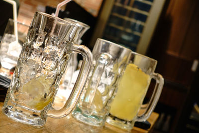 Close-up of beer glass on table