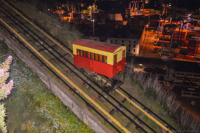 High angle view of train on railroad tracks at night