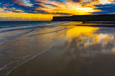 Scenic view of sea against sky at sunset