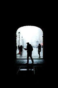 People walking in tunnel