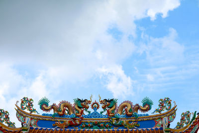 Low angle view of statue against sky