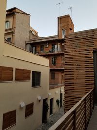 Low angle view of buildings in town against sky