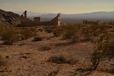 The former town of rhyolite in nevada is now a deteriorating ghost town