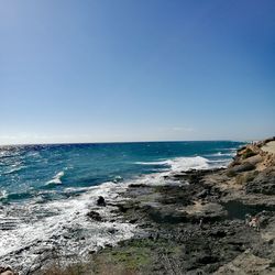 Scenic view of sea against clear sky