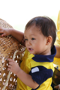 Close-up of cute boy looking away