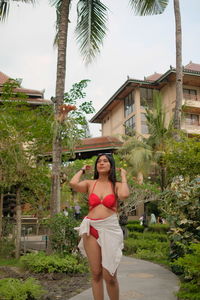 Rear view of woman sitting on swing