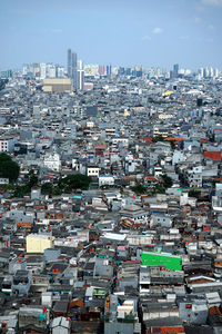 High angle view of city buildings against sky