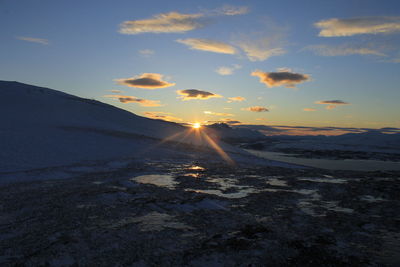 Scenic view of mountains against sky during sunset