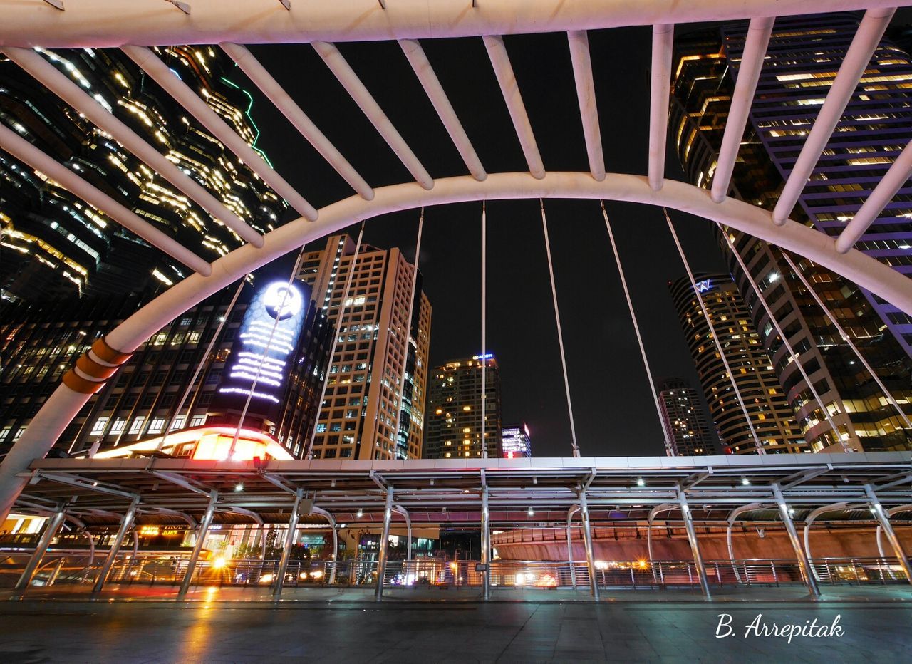 ILLUMINATED BRIDGE AT NIGHT