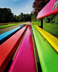 Surface level of multi colored umbrella against sky