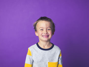 Boy against purple background