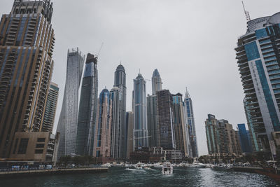 Low angle view of skyscrapers against sky