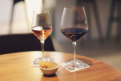 Close-up of wine glasses on table