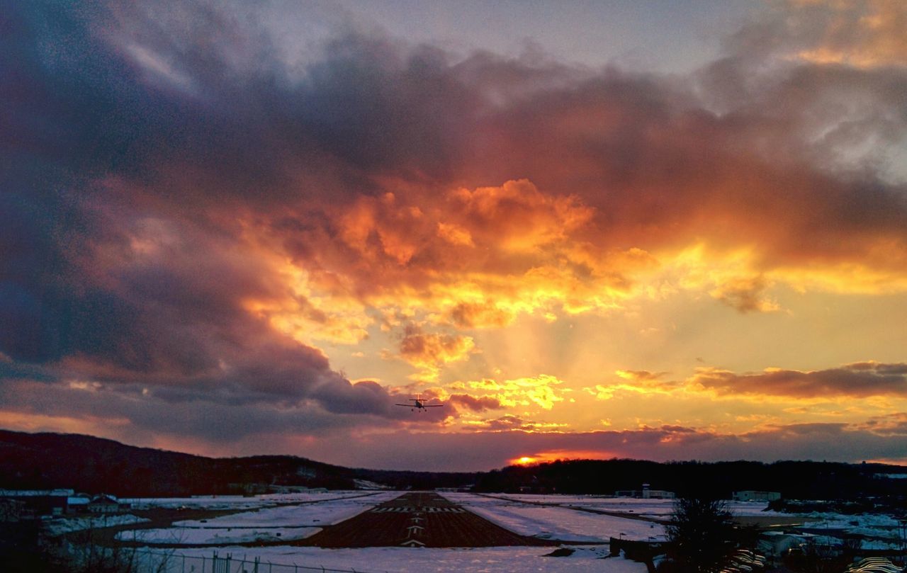 sunset, sky, scenics, cloud - sky, tranquil scene, beauty in nature, tranquility, orange color, weather, landscape, dramatic sky, nature, cloudy, idyllic, cloud, winter, mountain, snow, cold temperature, season