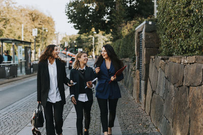 Female coworkers walking together