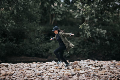 Side view of man on rock