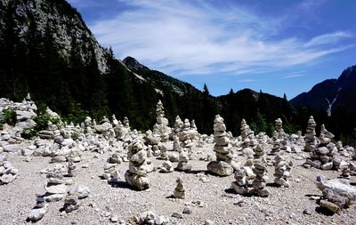 Panoramic view of rocks and trees against sky