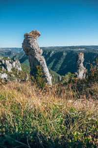 View of rock on mountain against clear sky