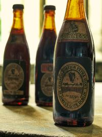 Close-up of beer bottles on table