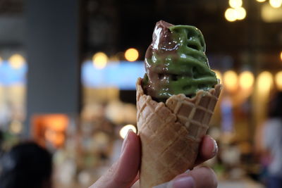 Cropped image of hand holding ice cream